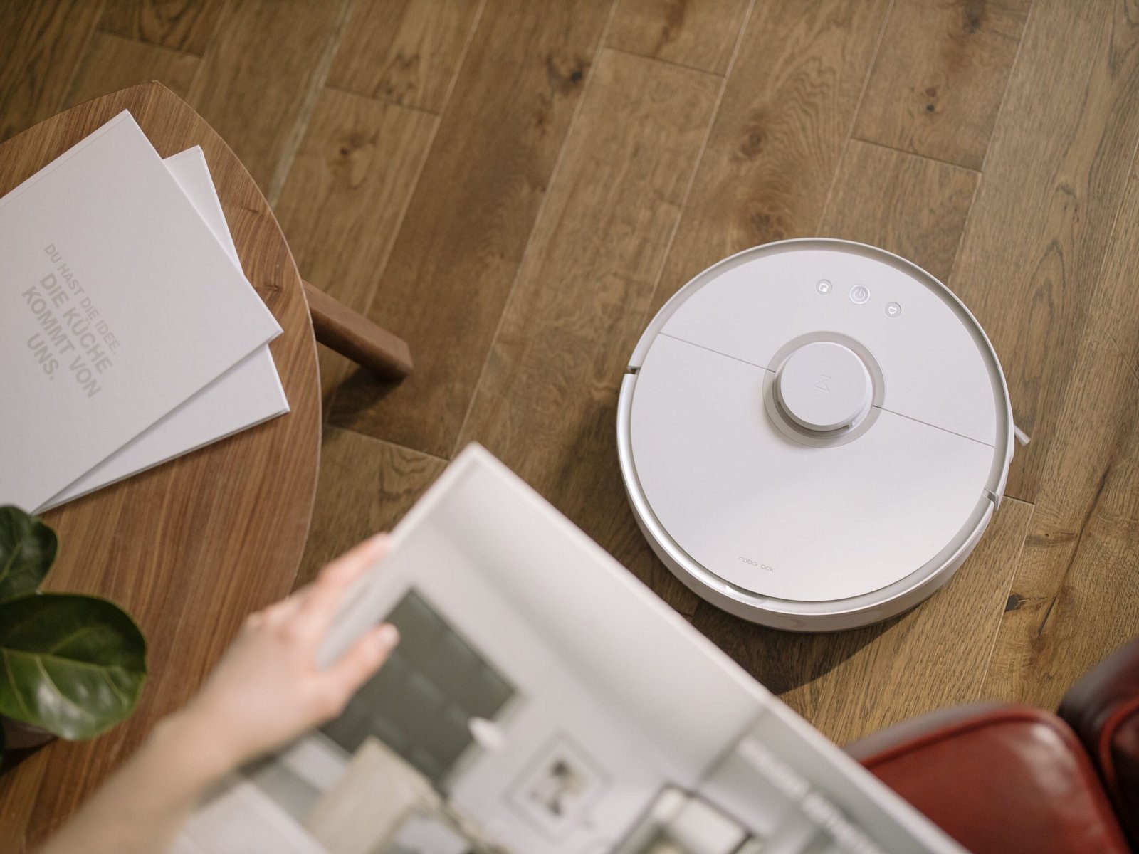 Robot Vacuums Are Getting Smarter in 2026: Shark, Dyson and Roborock Push Powerful AI Cleaning Forward 1 AI robot vacuums cleaning a modern living room in 2026
